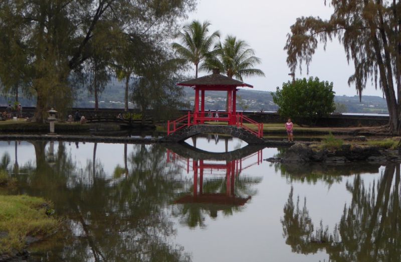 Queen Liliuokalani Gardens on the Big Island, Hawaii - red bridge, reflection in water