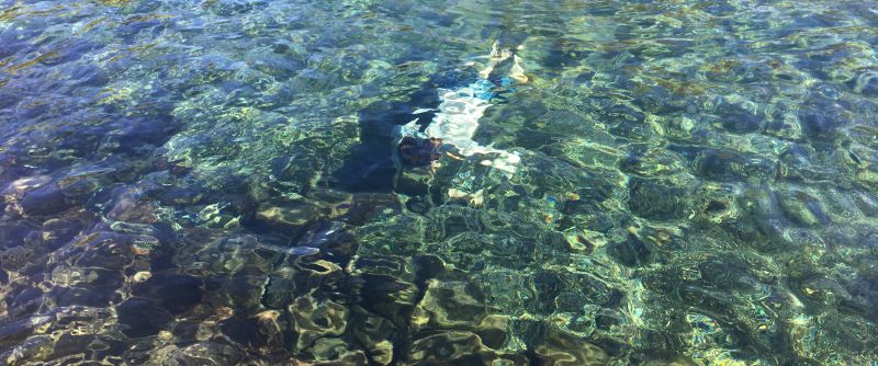 The water is crystal clear in Ahalanui Hot Pond