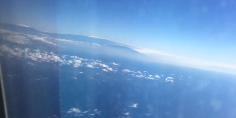 View of the Big Island from the plane - both Mauna Loa and Mauna Kea snow tops are visible