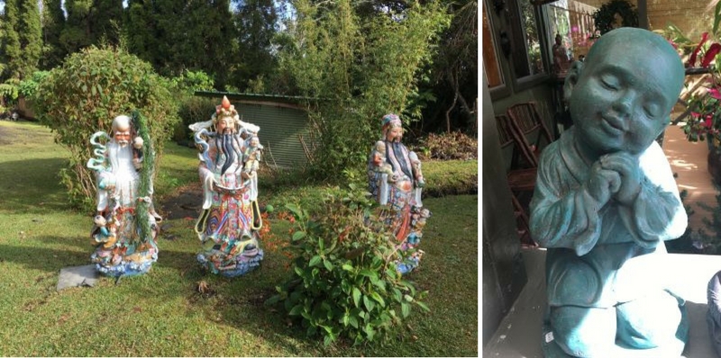 Statues of three Chinese wise men and Buddha child in Volcano Garden Arts