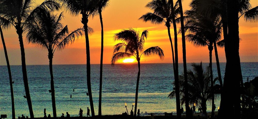 Sunset on Maui beach; sun going down the ocean