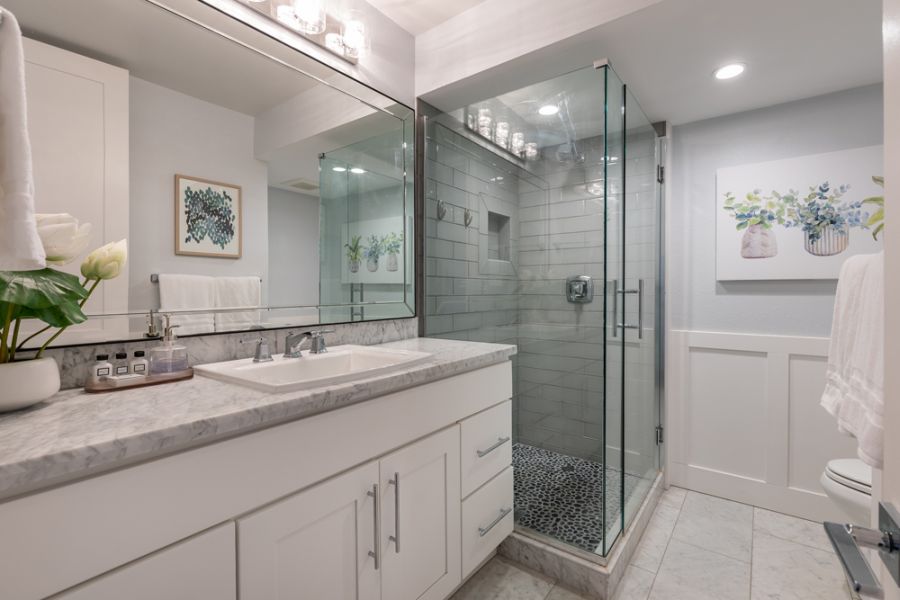 A bathroom, designed with the hospitality mindset of an innkeeper focused on guest satisfaction and comfort. 