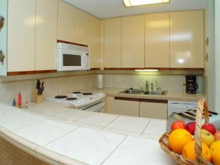 Upgraded kitchen with all new appliances including filtered drinking water and tiled counters.