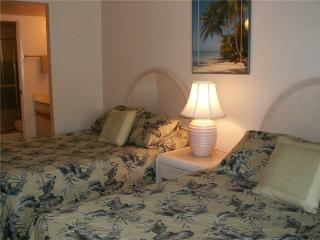 Second bedroom has two double beds, private lanai and bath.  Rents separately as studio unit Jan. - early May.