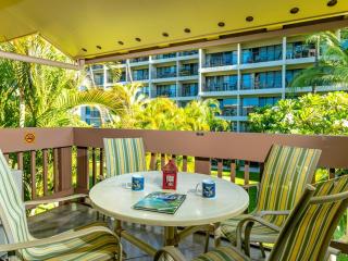 Surrounded by lush greenery the lanai is a relaxed space for morning coffee.