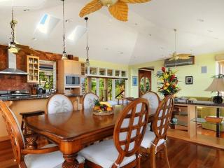 Dining area is next to the kitchen and living area; all areas are air-conditioned