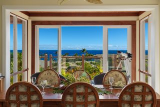 Dining area is next to the kitchen and living area; all areas are air-conditioned
