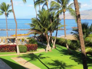 Menehune Shores 304: Morning view of outrigger canoes from our lanai