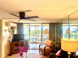 Living/dining room with a/c (note: no a/c in bedrooms) and smart TV opens to lanai. New ceiling fan January 2026.