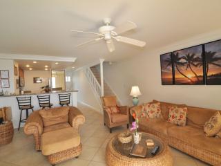 Another view of the living area with high bar counter next to the kitchen.