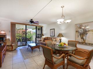 Room enough to walk around comfortably through dining/living room to the large lanai's outside dining.