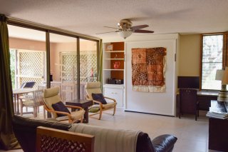 Large patio doors with views out to the private lanai.