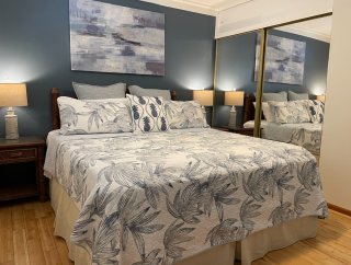 King sized bed with mattress topper for extra comfort. Lightweight Tommy Bahama quilt and Bamboo sheets for cool and comfortable sleeping.