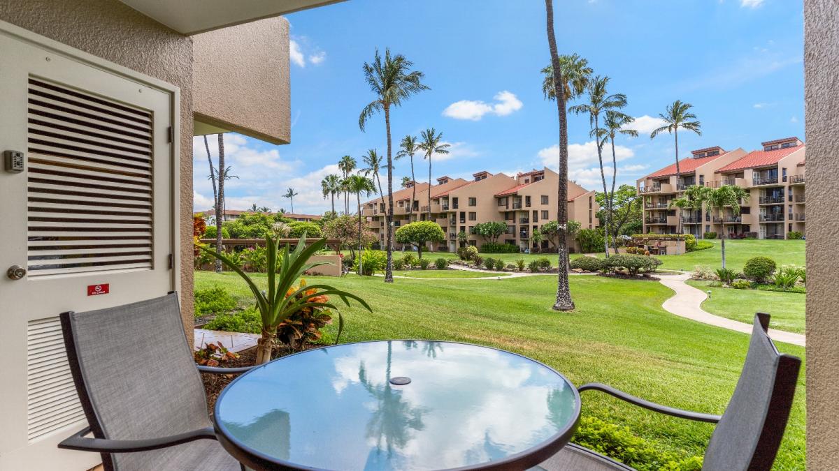 Lanai which opens up onto beautiful resort grounds..short walk to pools, jacuzzis, fitness, center, game room, tennis courts and beaches! Also a peak-a-boo ocean view for a ground floor unit!